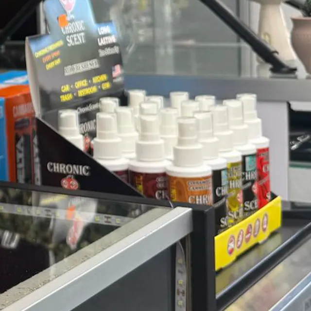 Odor-eliminating sprays and cleaners on the counter shelf