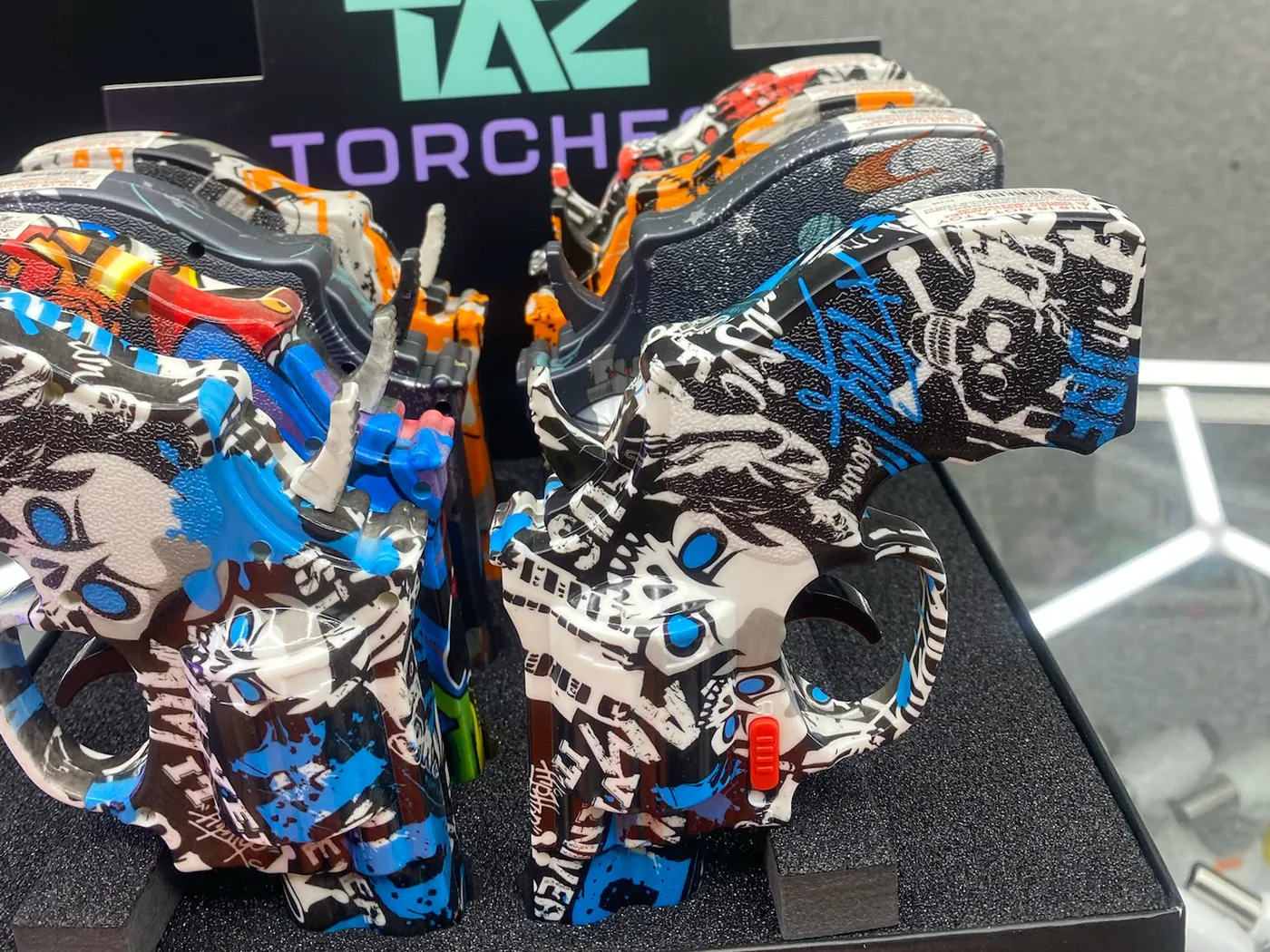 Graffiti-printed TAZ torch lighters on the counter display